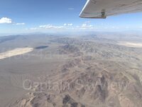 This capture reveals Indian Canyon Reservoir northeast (NE) afternoon daylight clear skies fall